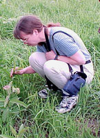 Woman looking at a butterfly