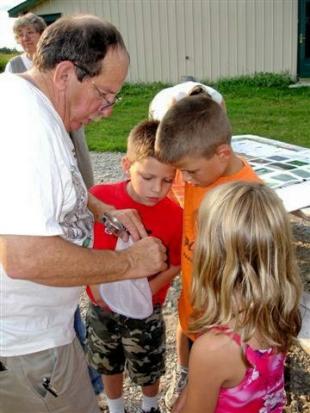 Denny showing eager students some monarchs Denny Brooks