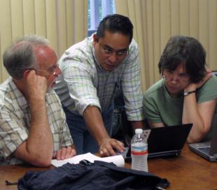 Eduardo talking with Dennis Frey and Karen Oberhauser Eduardo, Dennis, and Karen