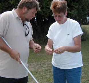 Gina with a volunteer (her husband Dave!) at Peninsula Point Gina Badgett and a volunteer